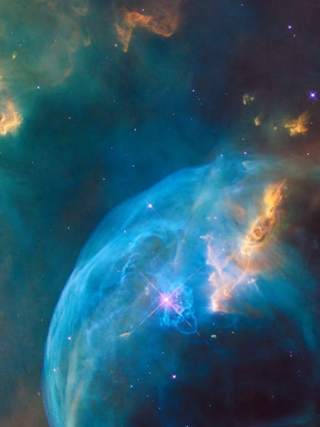 A blue nebula in deep space — the Cosmos background.